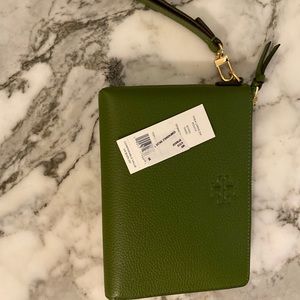 Tory Burch is wallet/clutch. New with tags.